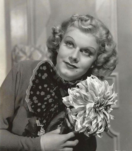 By June 1936, Harlow was comfortable and successful in her new coiffure. She and MGM experimented with different hairstyles, such as these cute rolls seen in LIBELED LADY. This publicity portrait for the film was made on June 28, 1936.