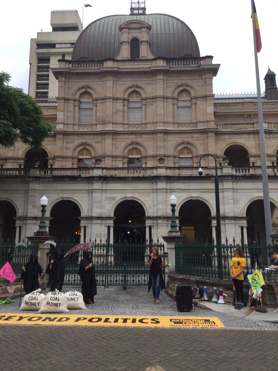 A banner saying "Beyond Politics". Bags saying "Dirty Coal Money". In front of Parliament House.