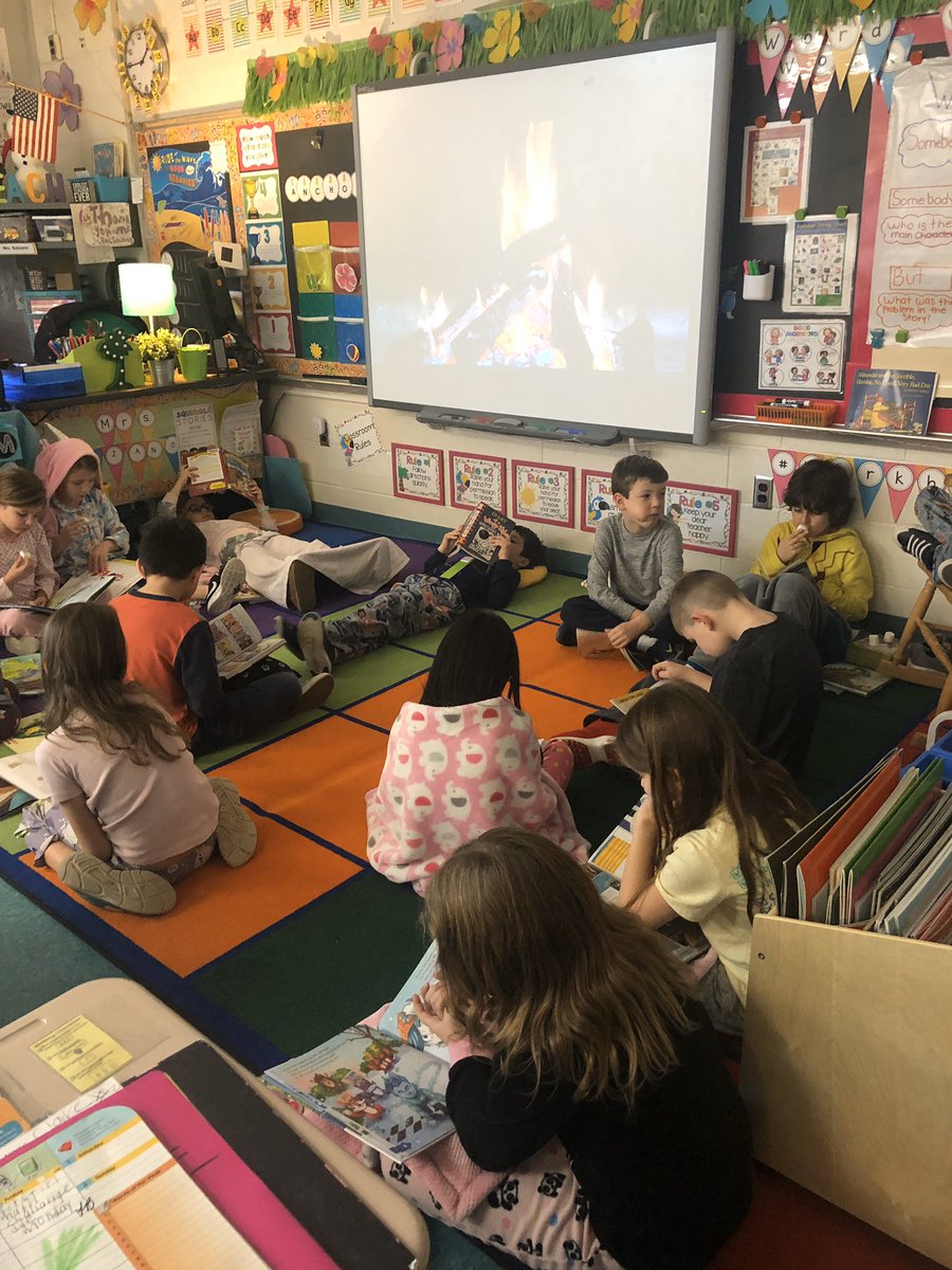 Reading by the fire 🔥 in our pajamas. What a great way to enjoy our books! <a href="/DESAACPS/">Davidsonville Elem.</a>