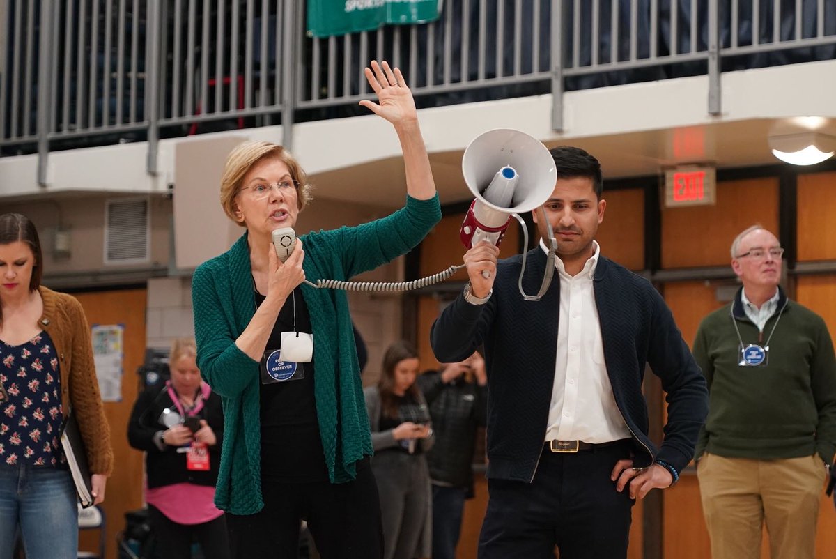 Elizabeth Warren addresses a crowd of caucusgoers in Des Moines.