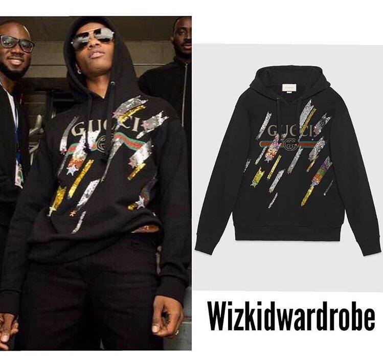 Wizkid at Arise Fashion Week wearing: Louis Vuitton Mini Varsity Blouson  $10,800 