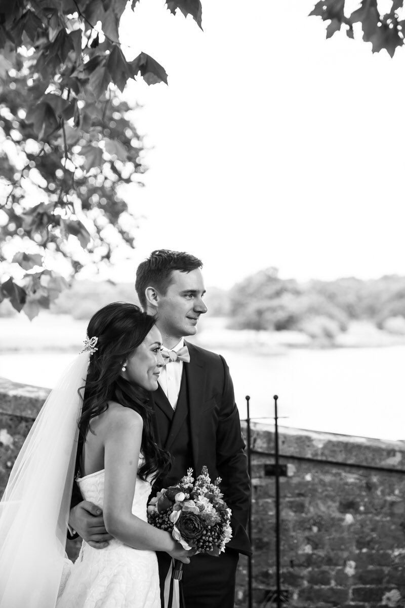 Bride and groom by river