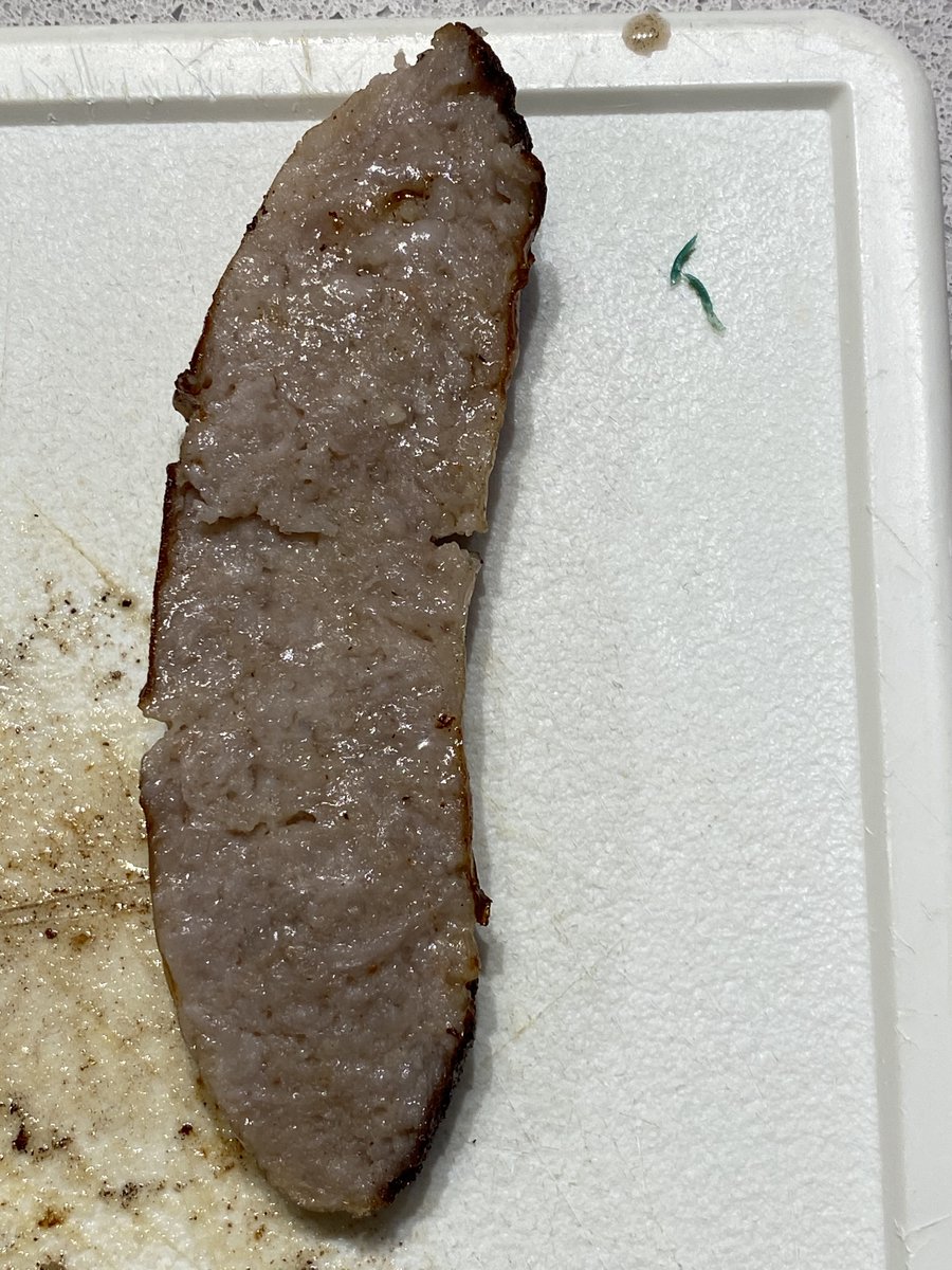 CiaranCanavan7's tweet photo. Cutting up some Tescos sausages for the kids last week and found this hard green plastic had been minced into the meat. Tried to inform @TescoIrl via contact form on their website so that they could recall the batch but never got a response. It seems nobody cares. @tesco #tesco https://t.co/GgTPewIP1Z