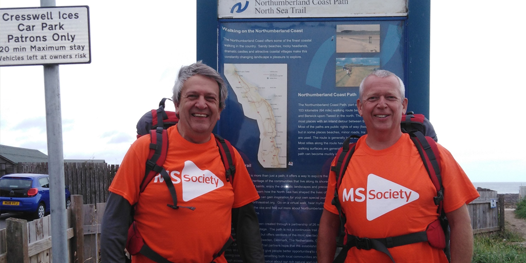 Mark and his brother Peter smiling to camera