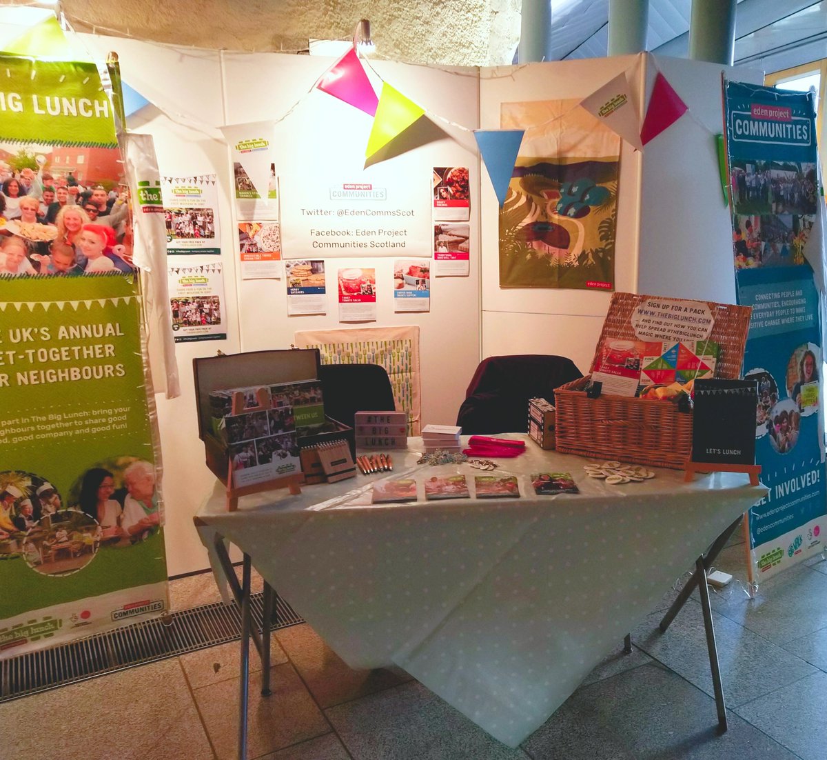 Display of posters and leaflets on a table and boards at the Scottish Parliament
