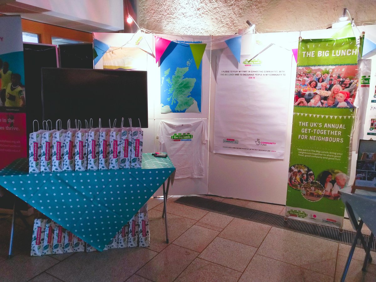 Display of posters and leaflets on a table and boards at the Scottish Parliament