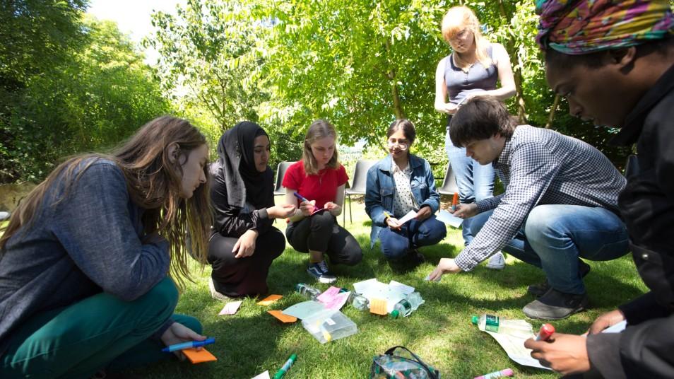 Young people in a park having a discussion 