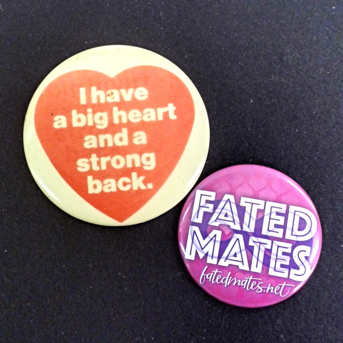 Two buttons- on with "Fated Mates" logo, and one with an image of a heart and text "I have a big heart and a strong back".