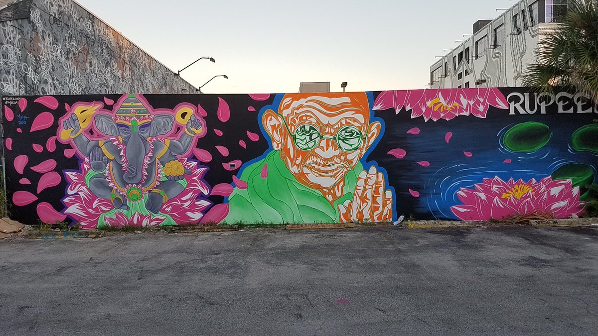 WynwoodMiami's tweet photo. Have you spotted this beautiful mural at Rupees ๐ 415 NW 27th Street? It is the only mural in Wynwood of Gandhi and Ganesh (Hindu god known as remover of obstacles). ๐จRoderick Mendoza @krtvrod & Marvin Vega @art_mvega. #BollywoodInWynwood #RupeesInc #RupeesWall https://t.co/Ko4gDQh9OS