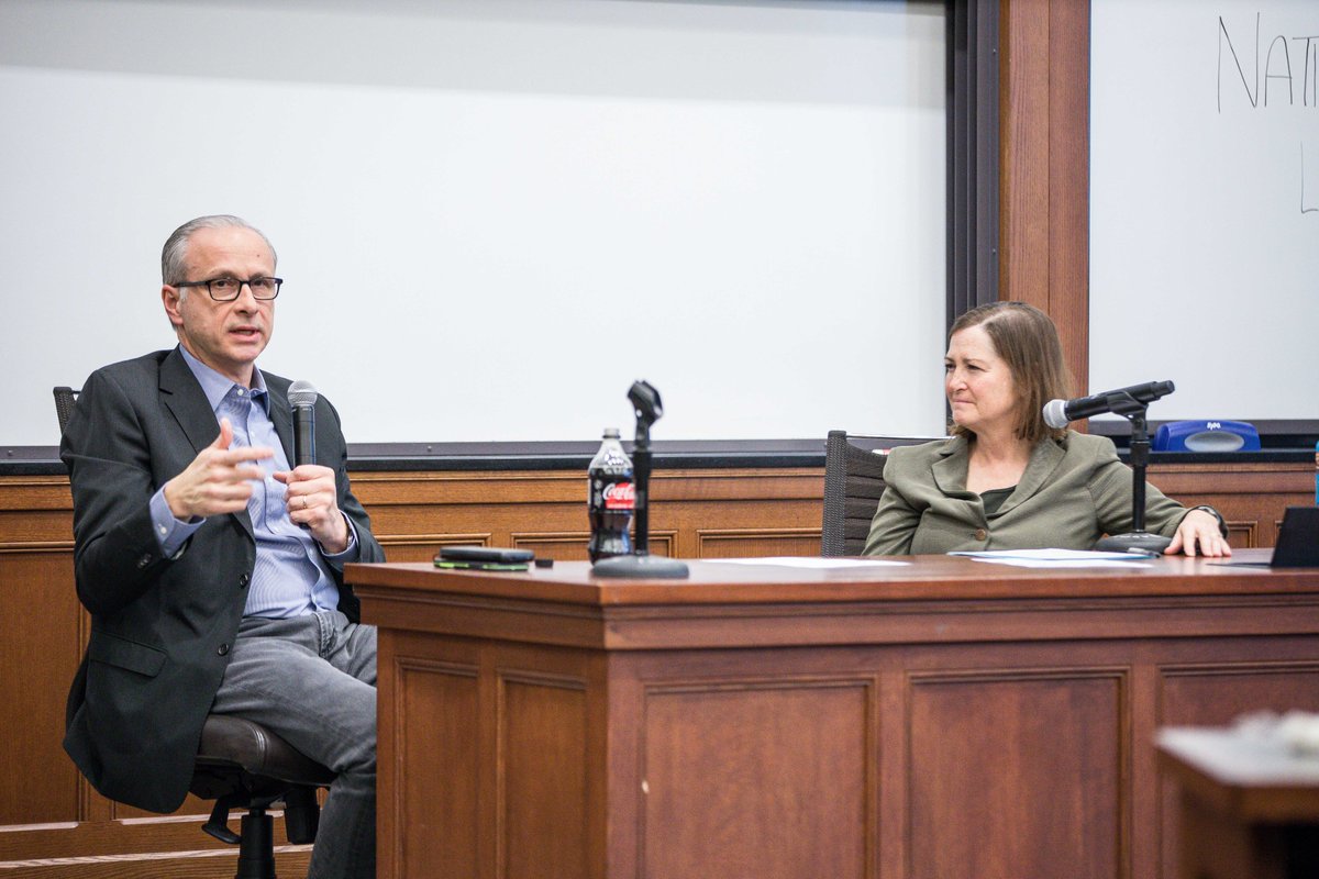 Jim Baker speaks to a classroom full of students.