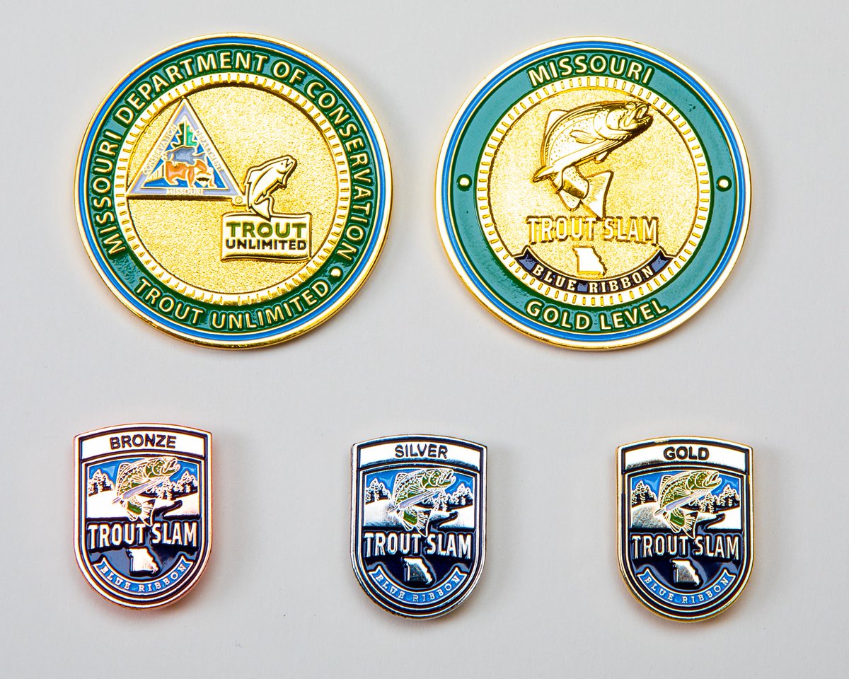 The medallion and gold, silver, and bronze pins awarded to Trout Slam anglers.
