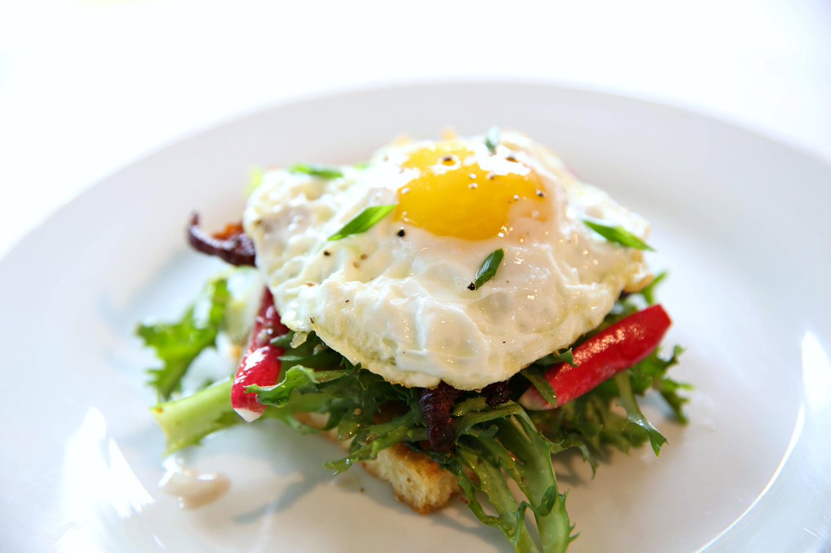 Cooking up a little sunshine to start the day... Sunny-Side-Up Egg with Brioche Toast and Frisée Salad!