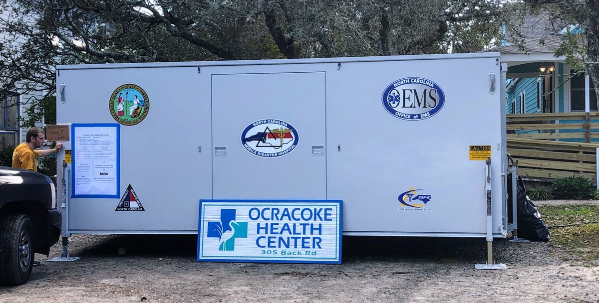 A trailer with several stickers and a temporary "Ocracoke Health Center" sign