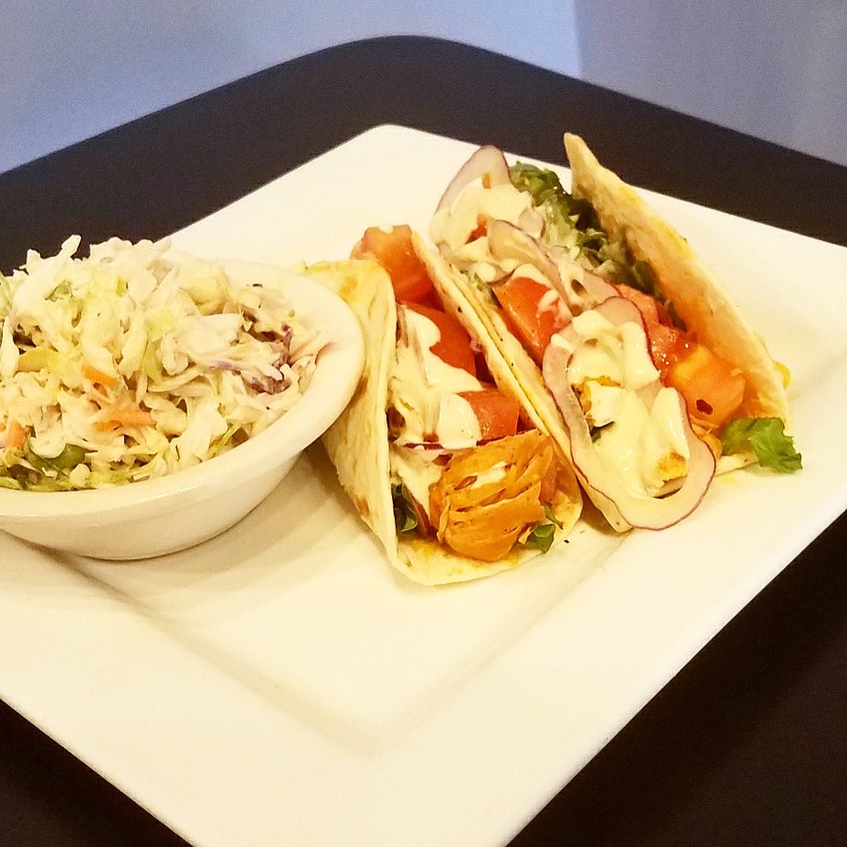 TACO TUESDAY — Taco Tinga- shredded chicken breast cooked in tomato and chipotle pepper with tomato, lettuce, onion, and cheddar cheese with avocado ranch dressing $10 with side