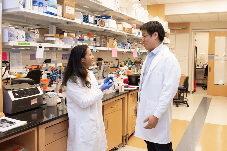 Sam Lai (right) and a lab team member