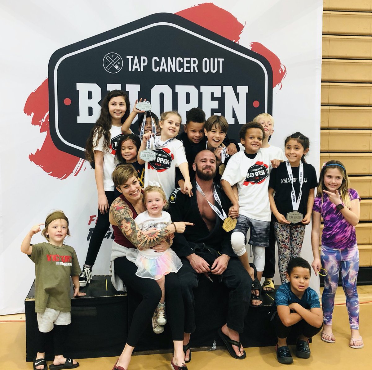 VictoryMMASD's tweet photo. Coach Adam and the Kid’s Jiu-Jitsu Team supporting the #TapOutCancer event, raising $150,000 to stamp out cancer. The kids took home Gold and other numerous medals while Coach Adam took first place in the Black Belt division. Congrats to Coach Adam &amp; the Victory Kid’s team. 💪 https://t.co/kZJgGbI9Nj