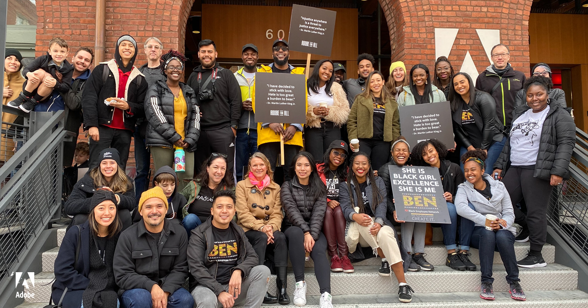 Adobe Black Employee Network members taking a group photo in front of the Adobe San Francisco office.