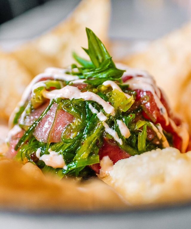 Our fresh Ahi Tuna Poke features sweet soy, spicy mayo, seaweed, and wontons!

📸: @jcpeats