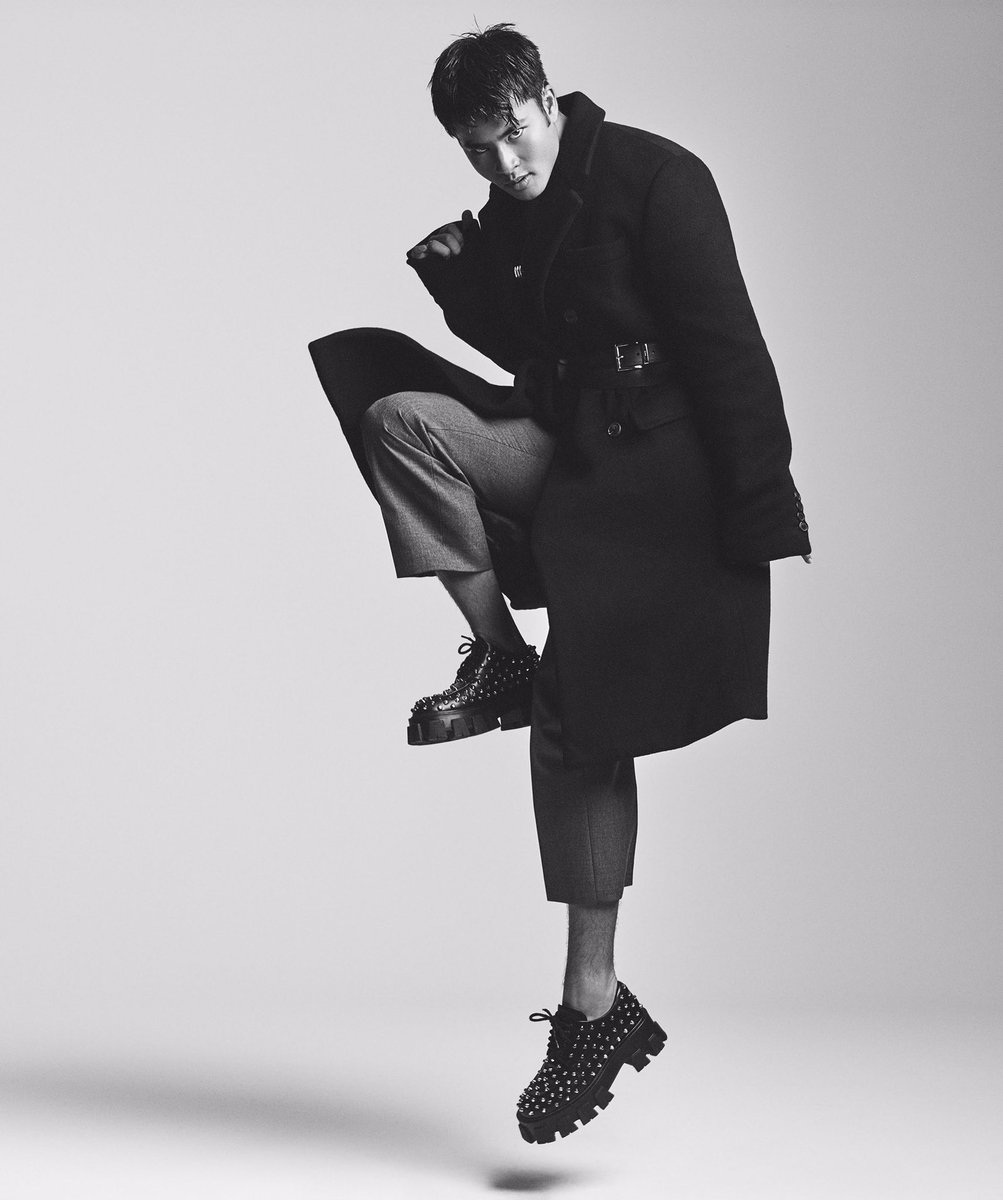 Chella jumping in a black outfit