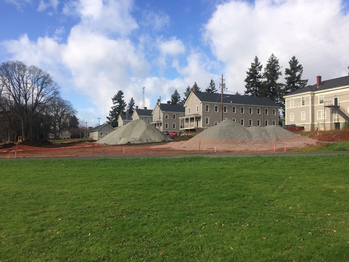 Two large piles of gravel in the East Barracks to be used in renovating the existing parking lot!