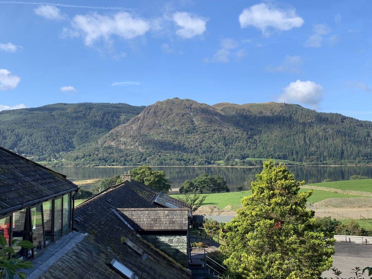 Image shows our centre with a background of Bassenthwaite Lake and the mountains, with blue skies overhead