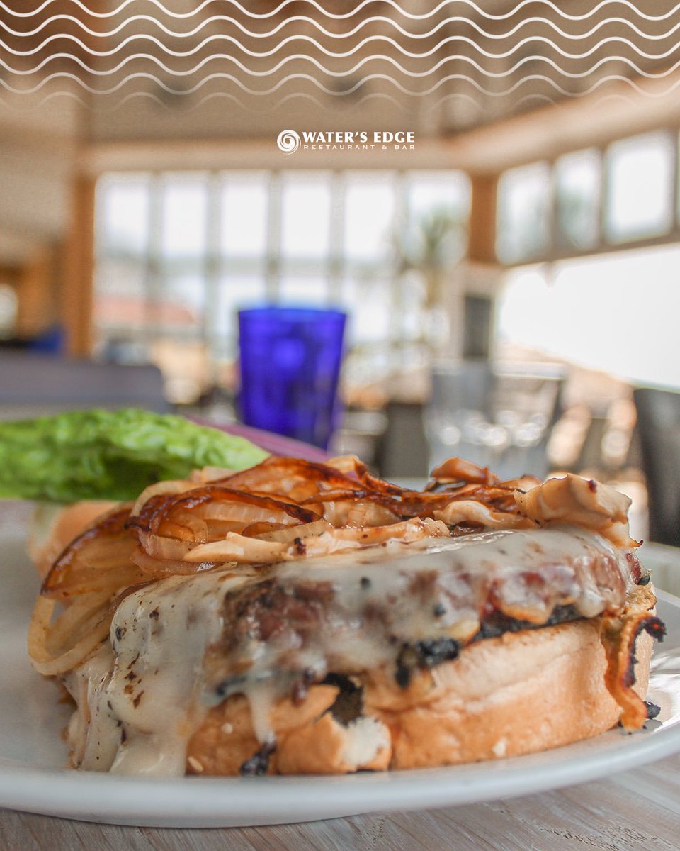 Our juicy Mushroom &amp; Caramelized Onion Burger will be your next favorite. Fresh Angus beef topped with Gruyere cheese, a mound of caramelized mushroom and onions, served with lettuce, tomato and onion with sweet potato fries on the side!
 #caramelized #onion #burger #aruba