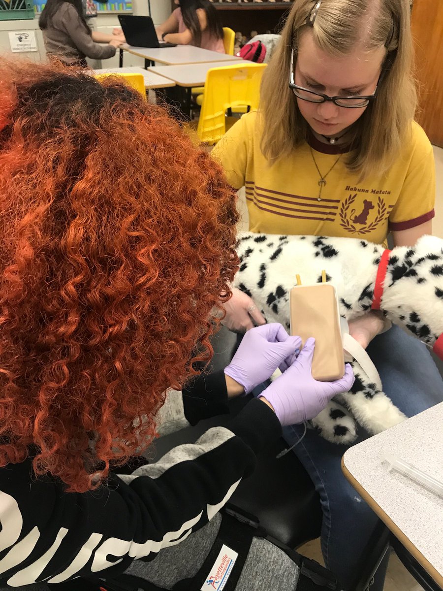 Rnbonesq's tweet photo. Celebrating CCS CTE Month with PFHS’s Academy of EMS!  Learning how to restrain a pup for a simulated blood draw in our Vet Med lab! https://t.co/wOUrwnQbU6
