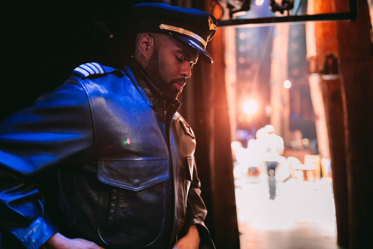Captain Bristol backstage in pilot costume preparing to go out on stage