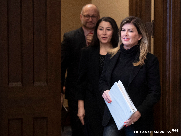 Rona Ambrose, Women and Gender Equality and Rural Economic Development Minister Maryam Monsef and Minister of Justice and Attorney General of Canada David Lametti make their way to speak in the Foyer of the House of Commons in Ottawa, Tuesday February 4, 2020. THE CANADIAN PRESS/Adrian Wyld
