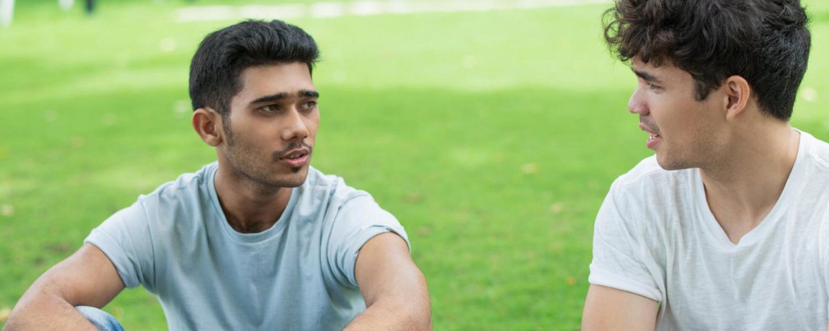 two friends talking outside