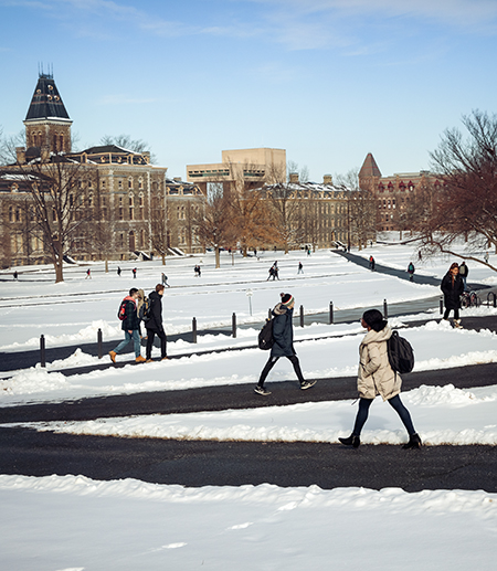 Students on the snowy Arts Quad