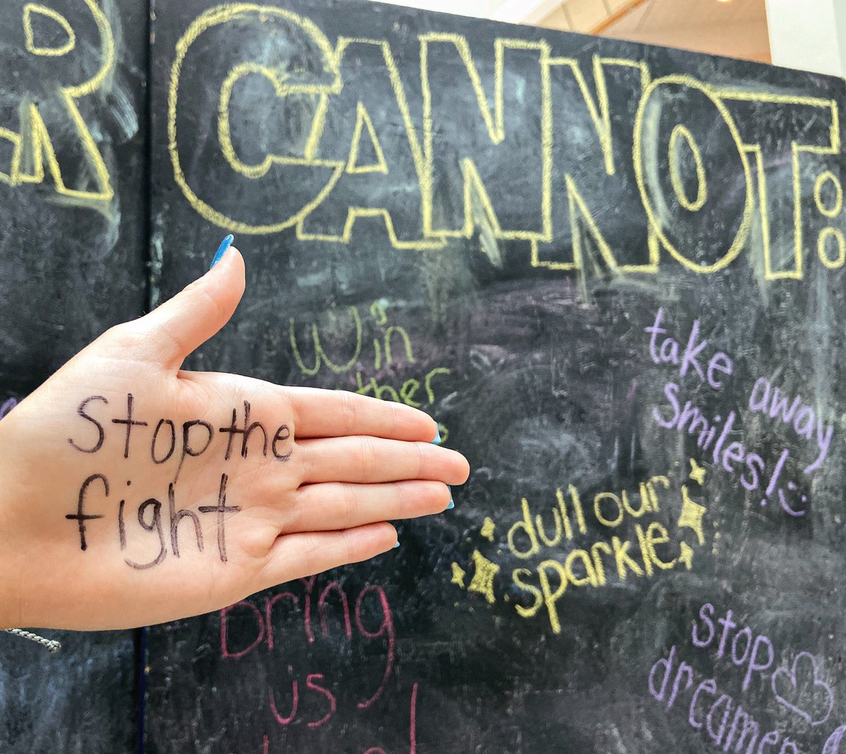 OnwardState's tweet image. For World Cancer Day, students wrote on a wall in the HUB what #CancerCannot.