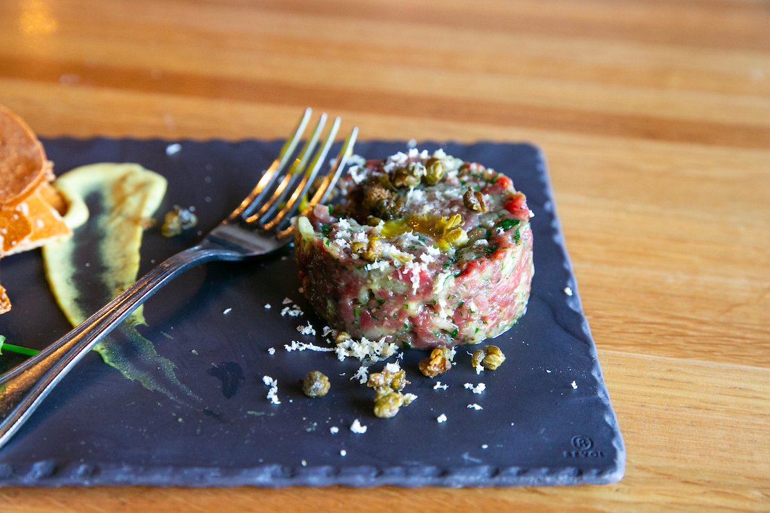 Start your meal with our Beef Tartare, served with a side of sea salt crackers for your scooping pleasure.