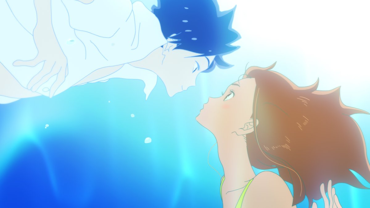 Underwater - Sunlight trickles in thru the water. On the left is a dark-haired boy in a white shirt. On the right is a brunette girl. They are leaning forward towards each other as if about to kiss. Movie is RIDE YOUR WAVE.