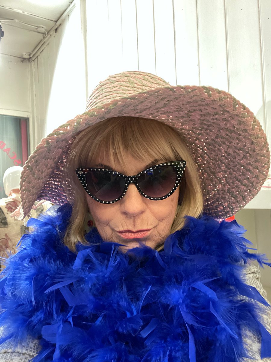 Indigo feather boa, wide-brimmed hat, sunglasses and a pout? Hmmm, maybe not.