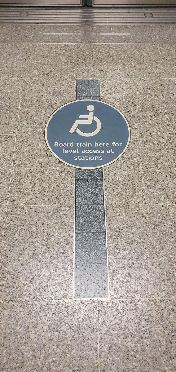 Board train here for level access at stations on the ground mid platform with wheelchair logo.