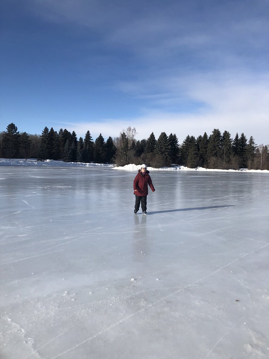 Girl skating under a blue sky
