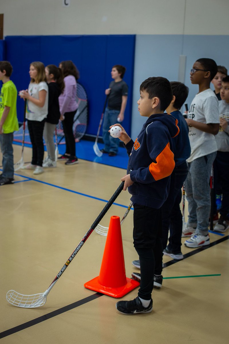 SYC427's tweet photo. Students at West Elementary School are learning about hockey in their physical education class! Today they had visitors from the Chicago Blackhawks to teach them more about the sport!! #Empowering2Succeed https://t.co/tZkaEA3bZ3