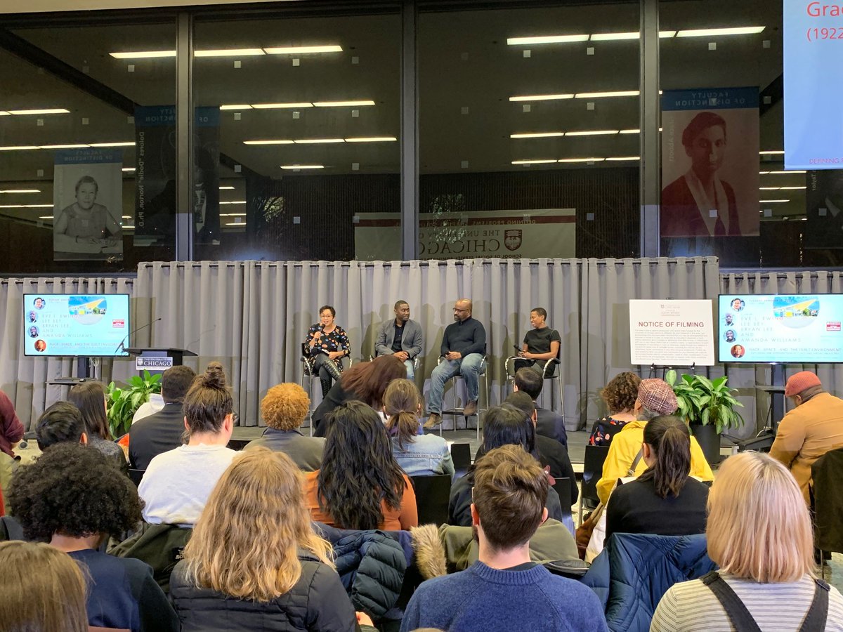 Eve Ewing and the three panelists, Bryan Lee, Lee Bey, and Amanda Williams are sitting on the stage in front of 150 guests.