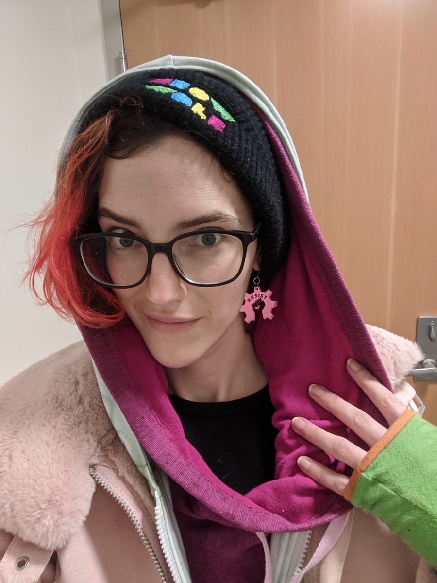 LaserMistress's tweet photo. Remember kids, #Resist. (earrings of a closed fist inside a gear referencing the open source hardware symbol with "resist" engraved on top.) #opensourcehardware #hardwarenerd https://t.co/YZWRJ8VJHw