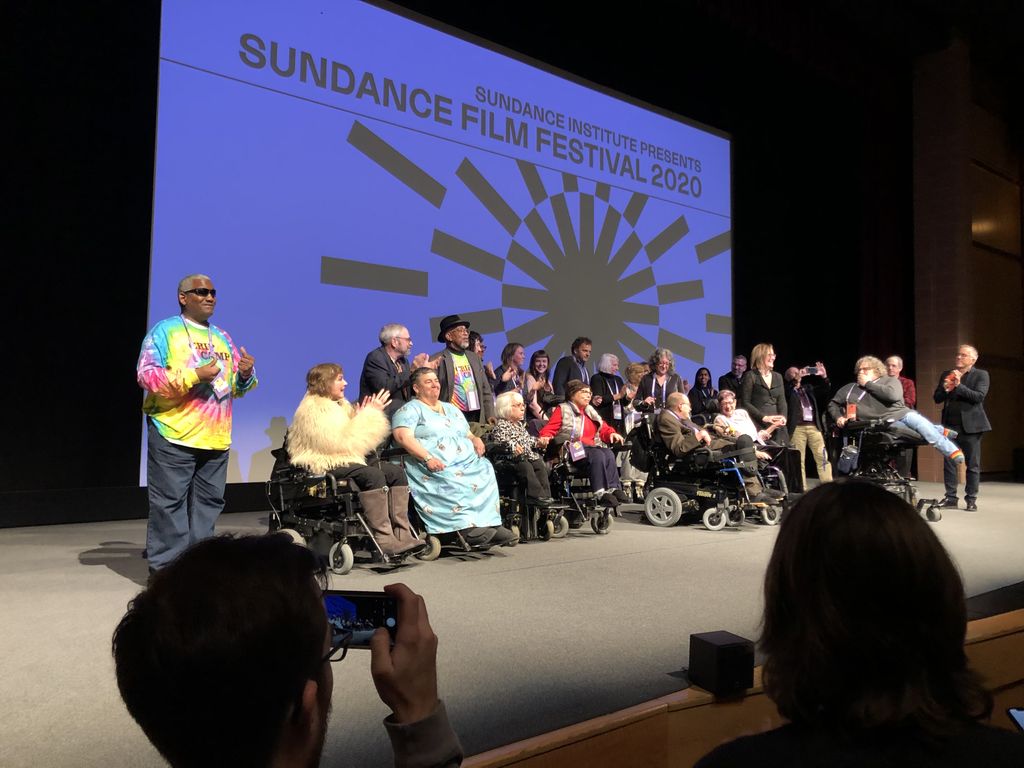 Judy on stage along with other Crip Camp campers and staff who help created Crip Camp 