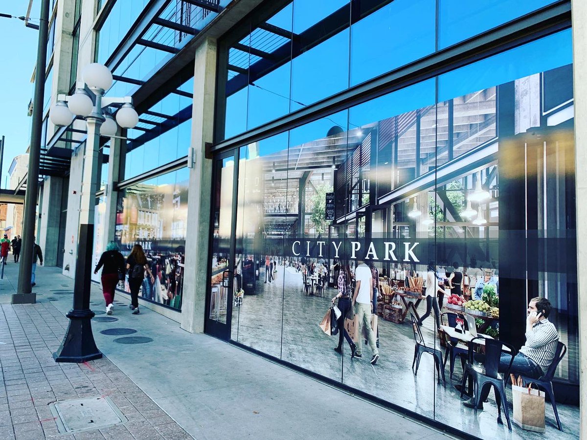 totallytucson's tweet photo. Sneak preview. New photo murals were installed today spanning full ground floor frontage at mixed-use new City Park bldg 40 E. Congress @DowntownTucson Major tenant: @HexagonMining A food court will open soon. @FastSignsTucson installed these fun window murals. #Tucson #CityPark https://t.co/eIzj3beCu4