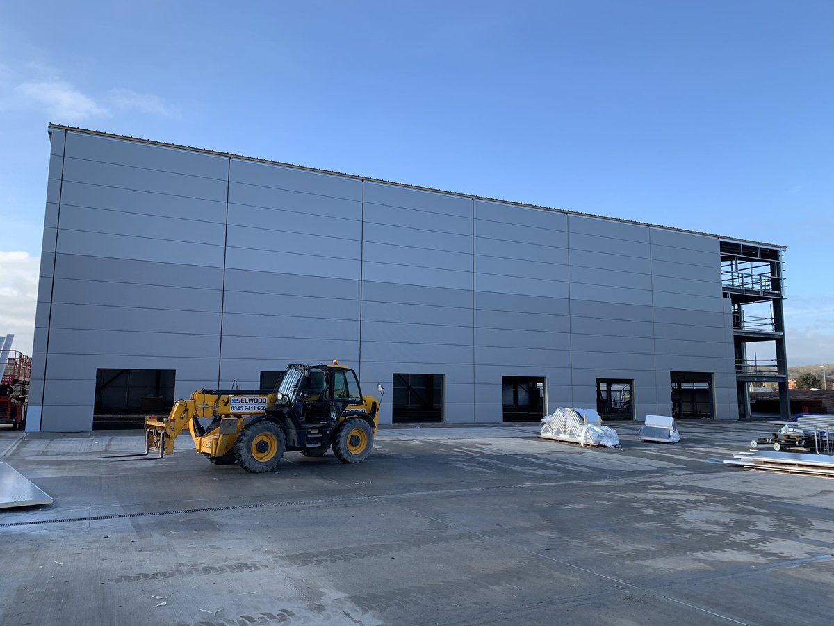 calibrebuild95's tweet photo. Despite some tough weather, delighted with progress at #Burton with wall cladding being installed..exciting couple of months ahead as we move to weather-tightness and internal fit out stages #storage #space #summer2020 #thinkconstruction #thinkcalibre @SureStoreLtd @C4_Projects https://t.co/wEn2KIuWKd