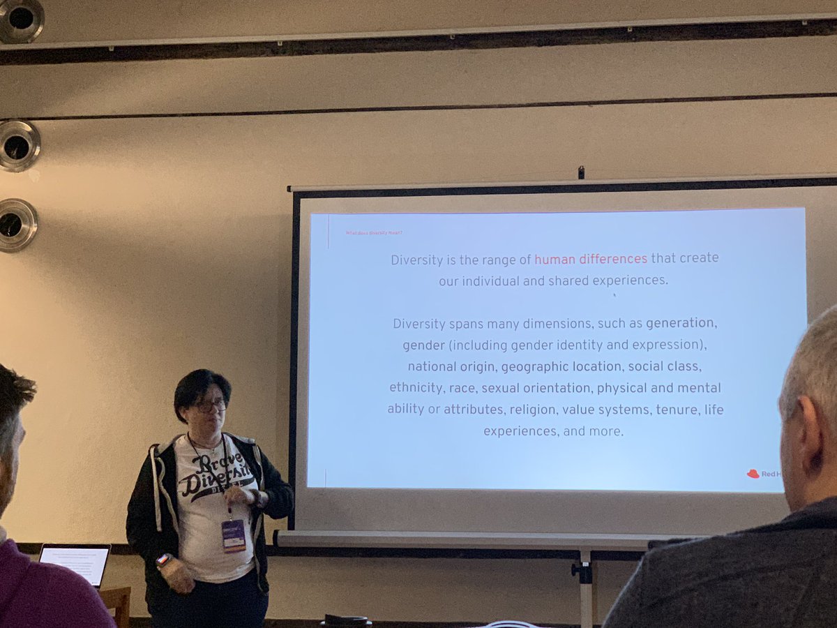 Imogen standing next to the diversity definition slide.