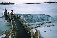 frozen lake with swimmers