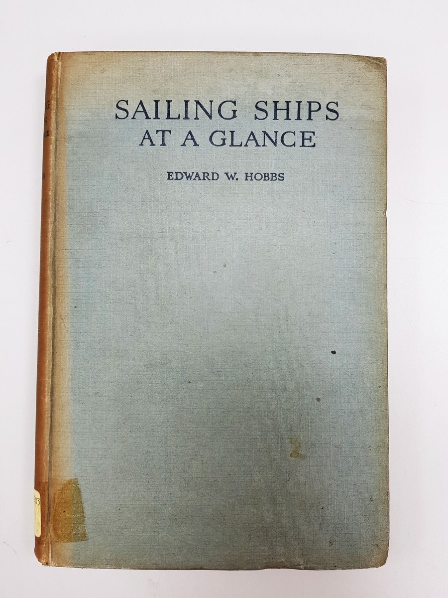 Front cover of the book Sailing Ships At A Glance, by Edward W. Hobbs. The cover is blue with black font, with brown edges where it has discoloured. 