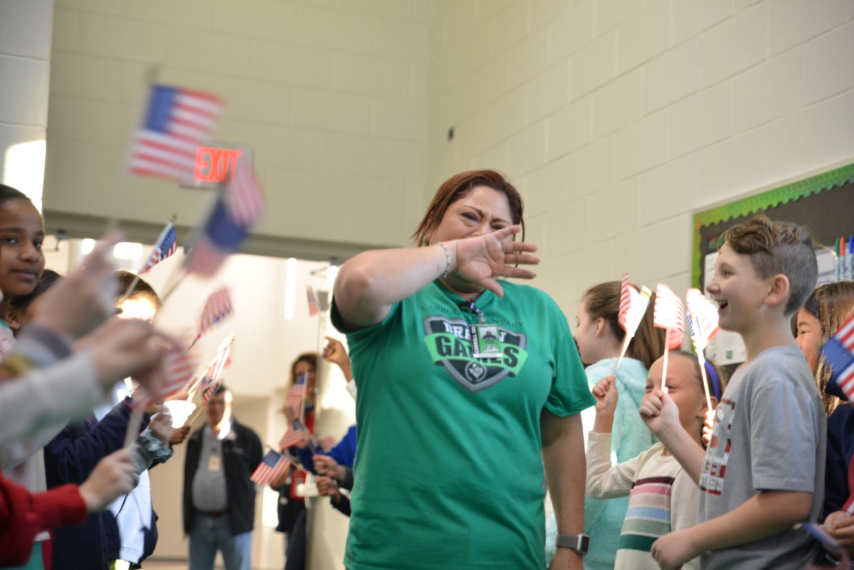 Carrollisd's tweet photo. It was an amazing morning at @CESSouthlake. The students and staff threw a surprise celebration for one of their staff members, Jenny Lopez, who recently completed all the requirements to earn her U.S citizenship! Congrats, Ms. Jenny, we are so excited for you! #WeAreDragons https://t.co/WXJdMMdxq3