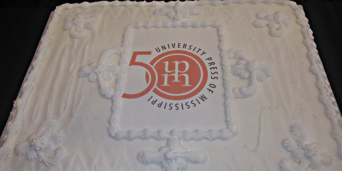 Picture of a cake with the University Press of Mississippi 50th anniversary logo on the front.