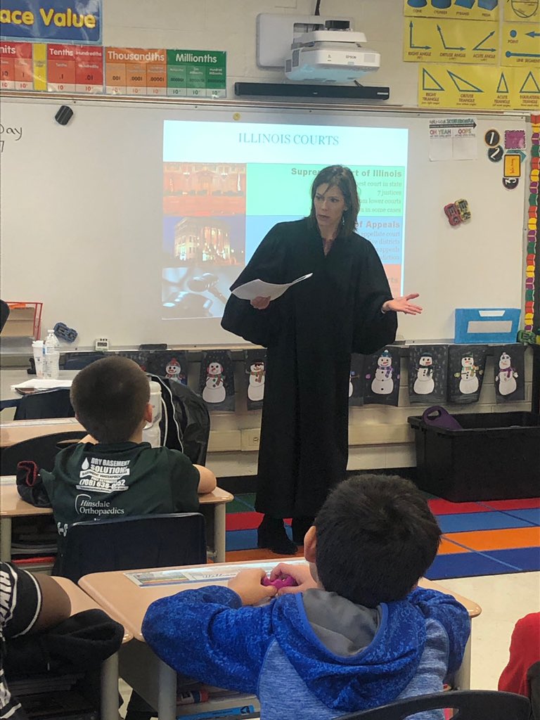 108Ryan's tweet photo. Judge Brosnahan speaks to Southeast 5th grade about judicial branch. #D124empower #D124achieve #D124 https://t.co/kZzgHqNu9o