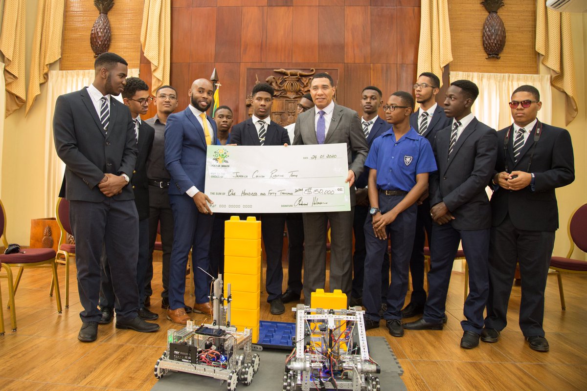 PositiveJamaic1's tweet photo. This afternoon the Positive Jamaica Foundation made a donation to the Jamaica College Robotics team. 
Chairman, @AndrewHolnessJM says he remains very impressed with the students and their innovation and interest in the field of robotics. https://t.co/mSs2n3mYDY